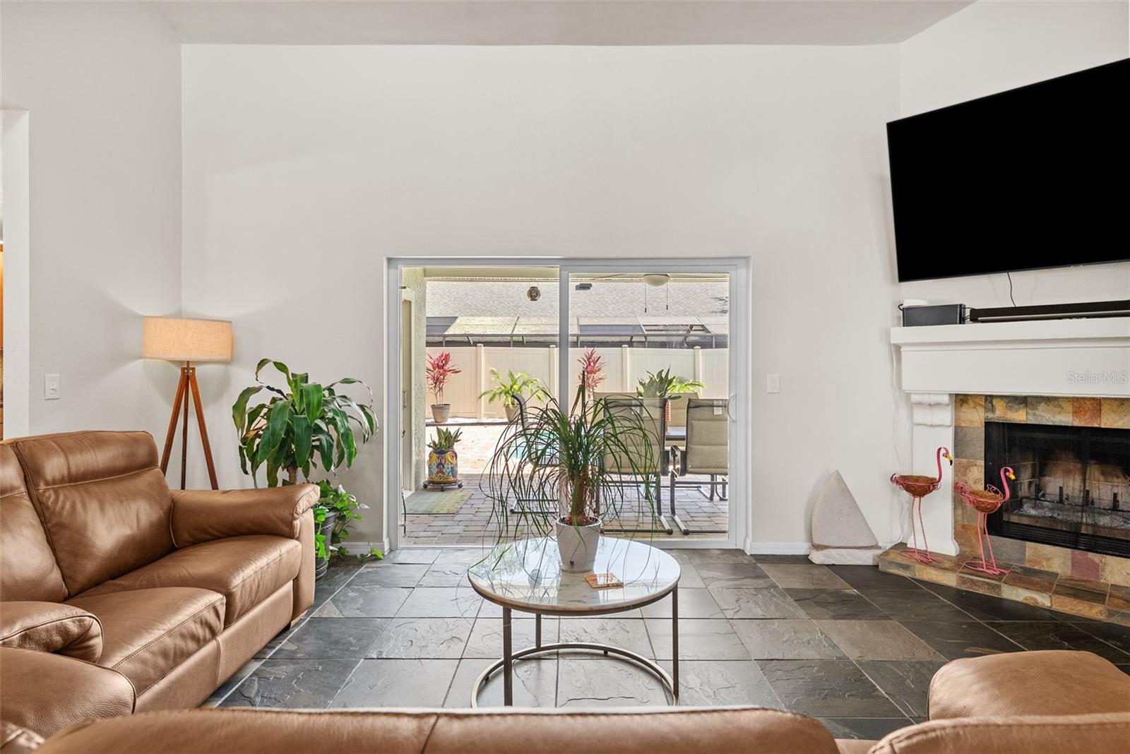 Living room from front door with sliding glass doors to pool oasis