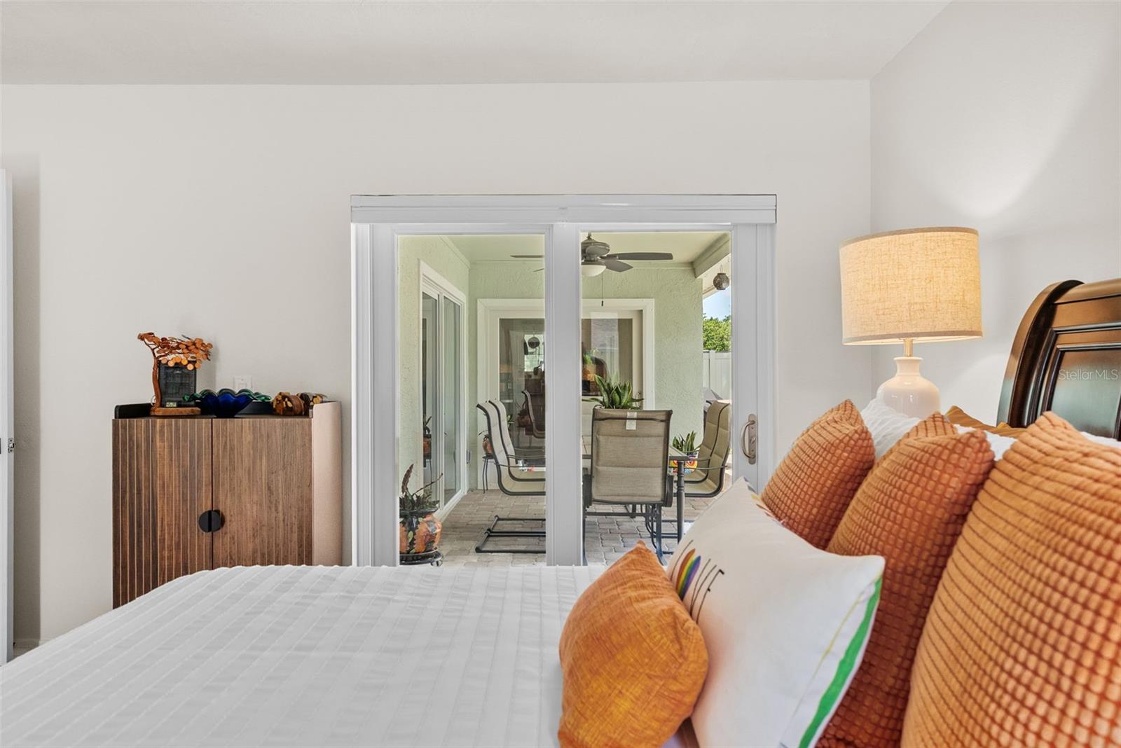 Primary en suite features French doors to pool area.