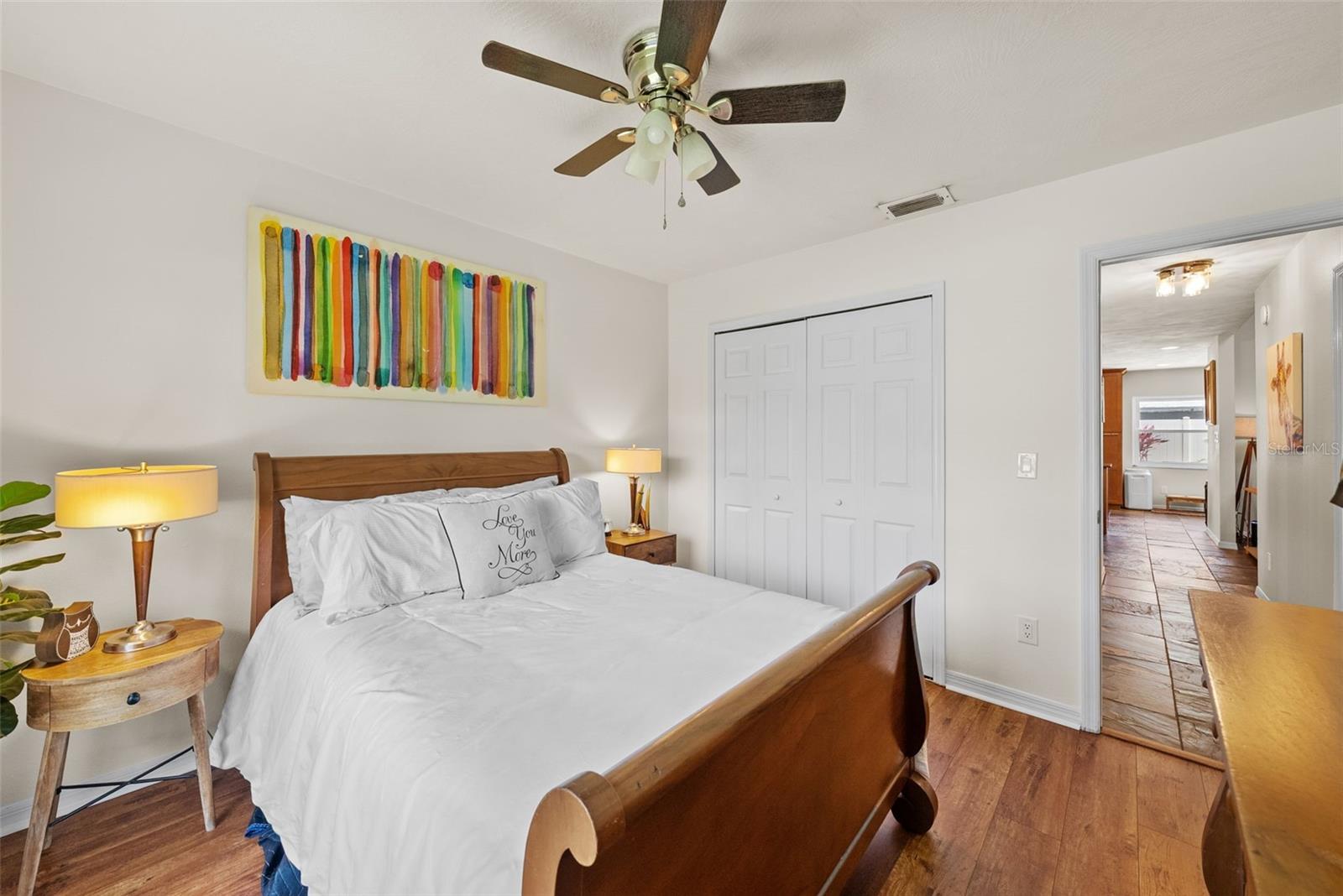 Bedroom number two has large closet and doorway down hall through kitchen.