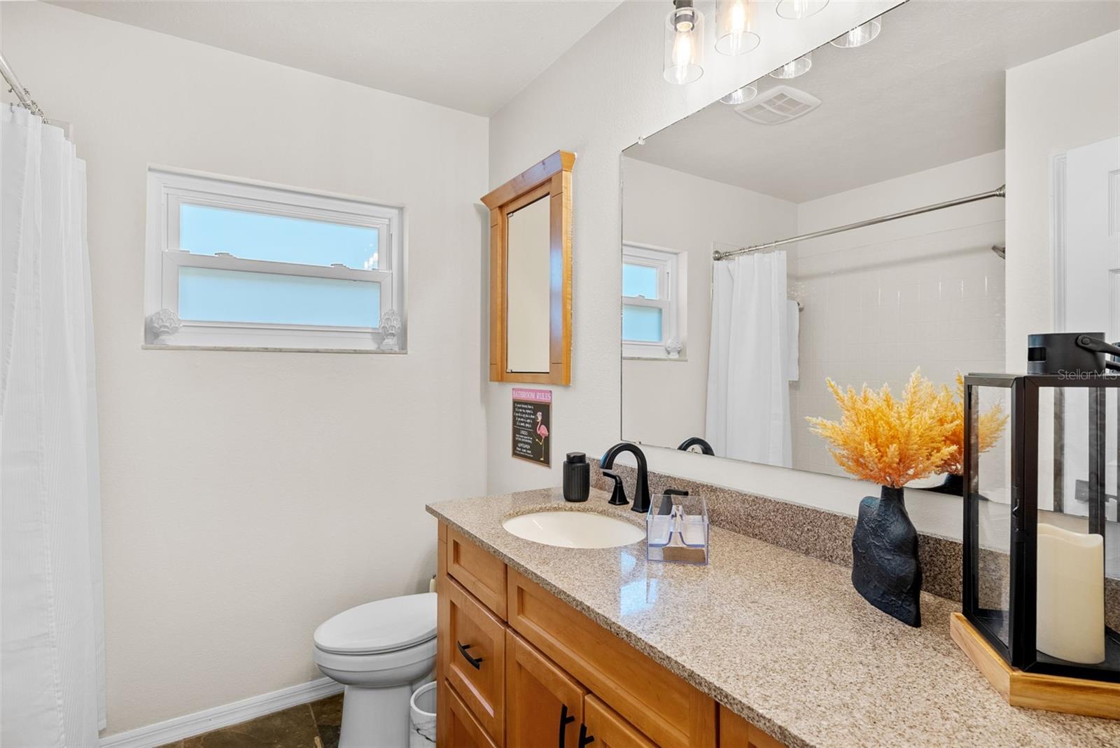 Bathroom number two in hallway off kitchen for guests and entertaining perfect location