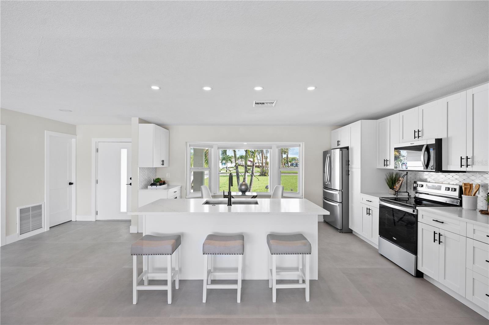 Built-in dry bar with wine fridge and custom cabinetry.