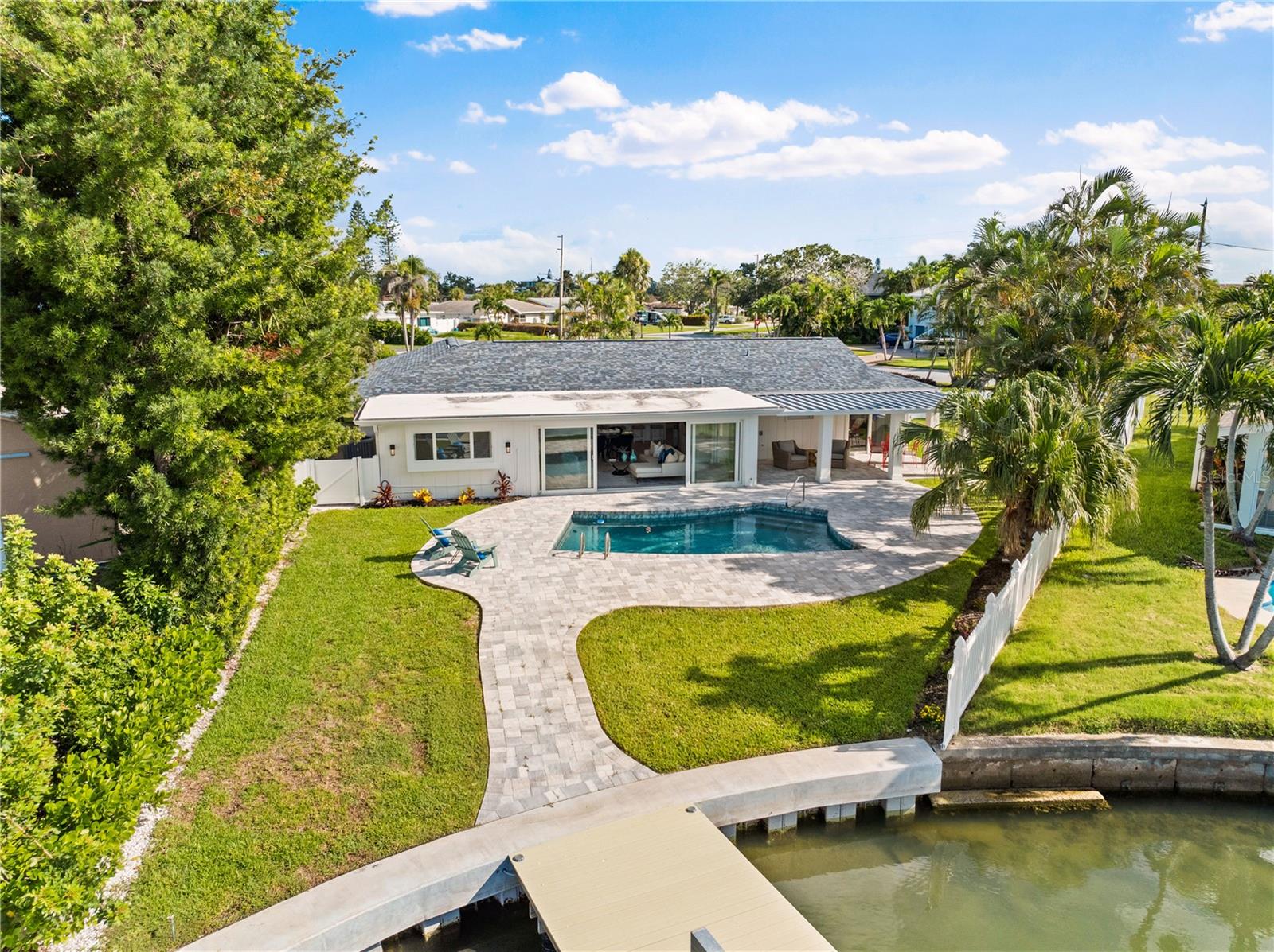 Expansive outdoor entertaining space with water views