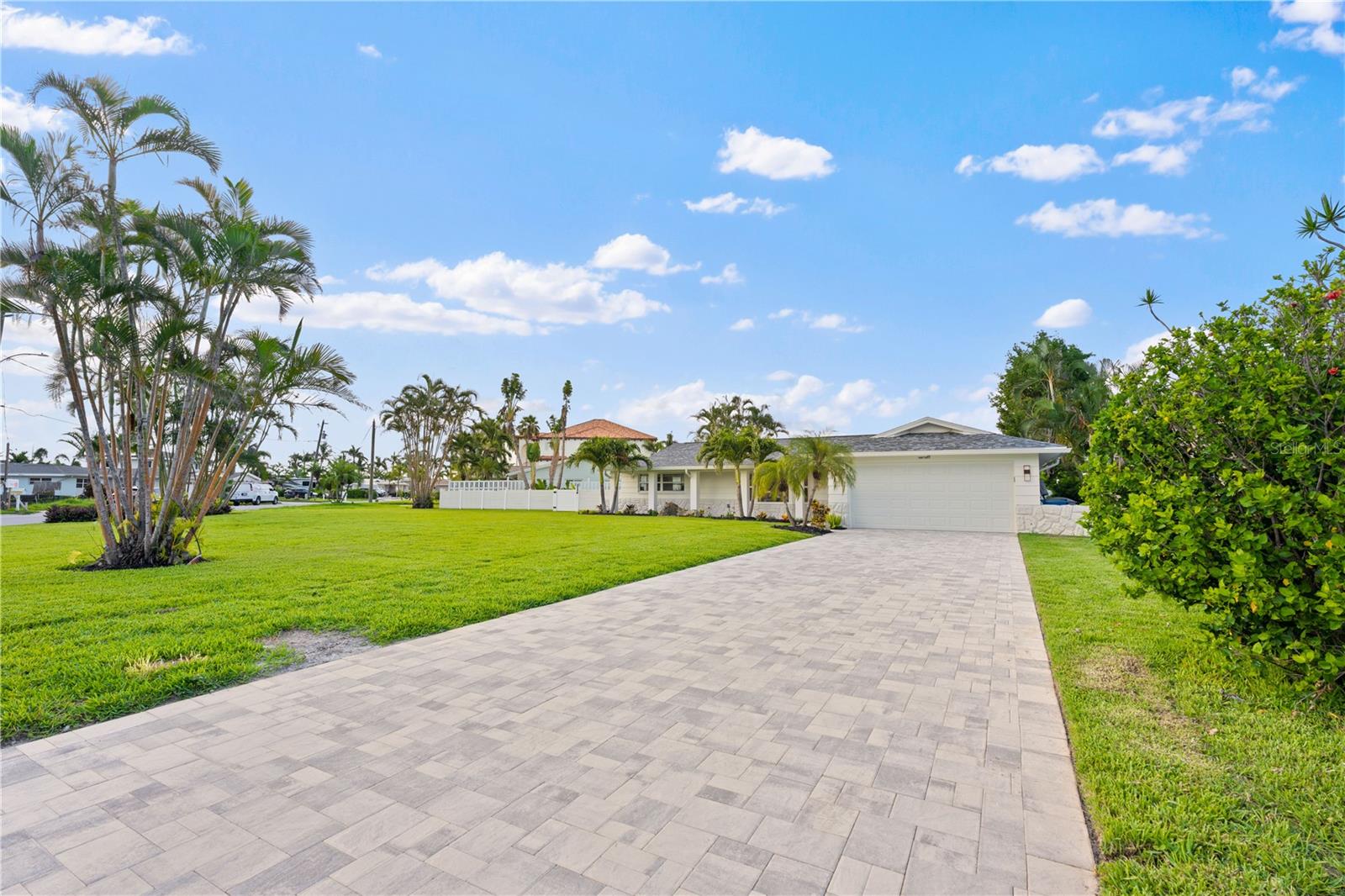 New paver driveway, hurricane-rated garage door.