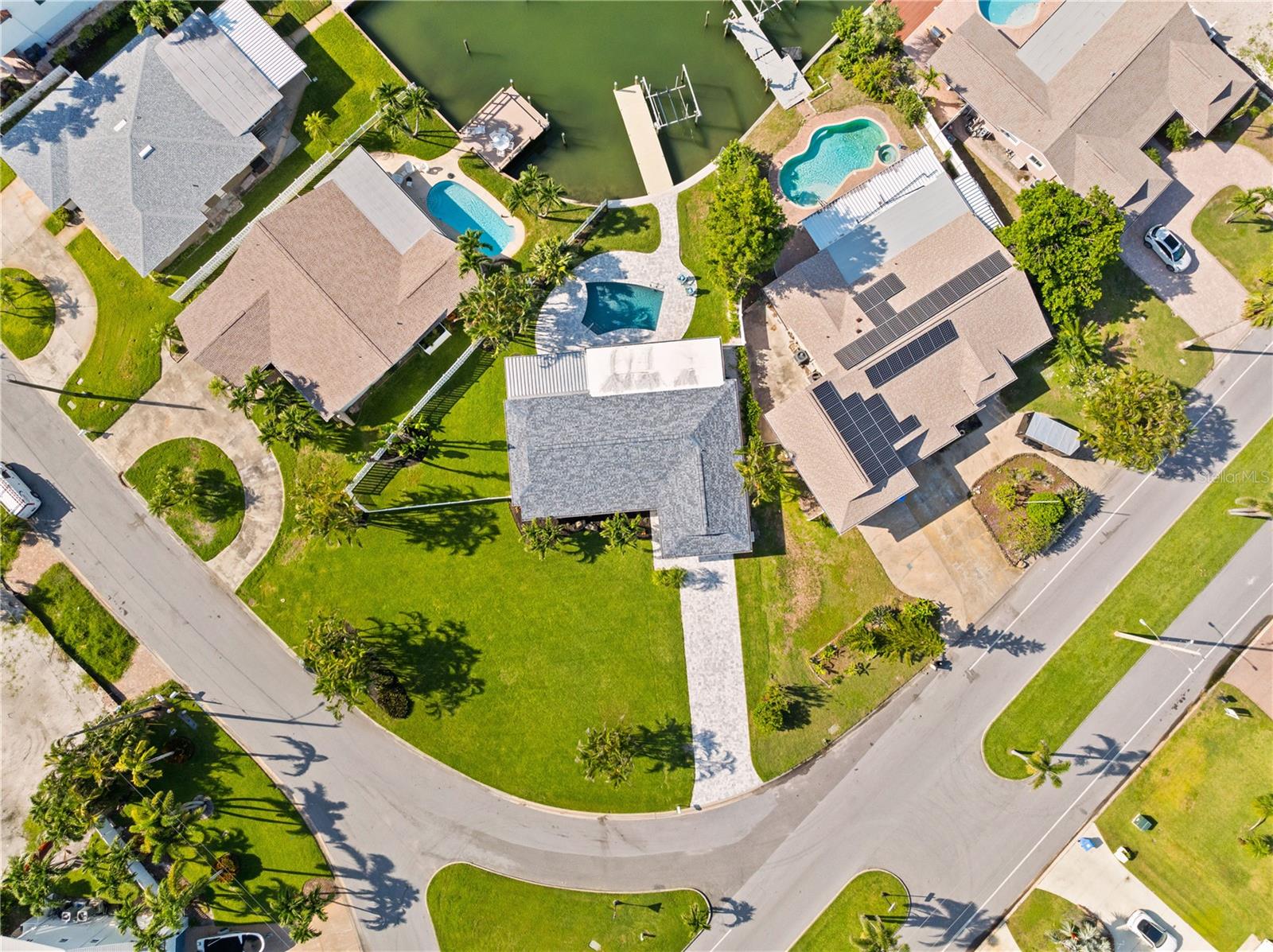 Oversized corner lot with new dock, lift, and seawall.