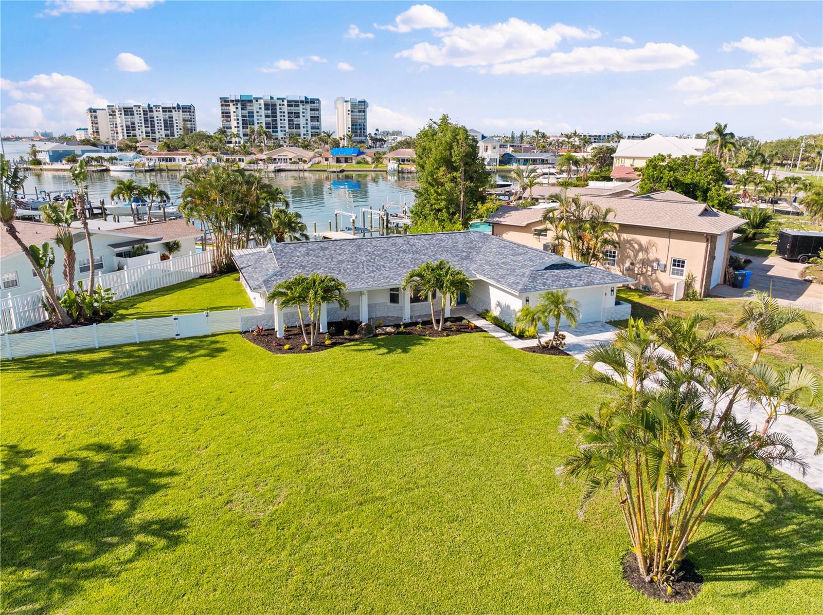 Oversized corner lot with new dock, lift, and seawall.