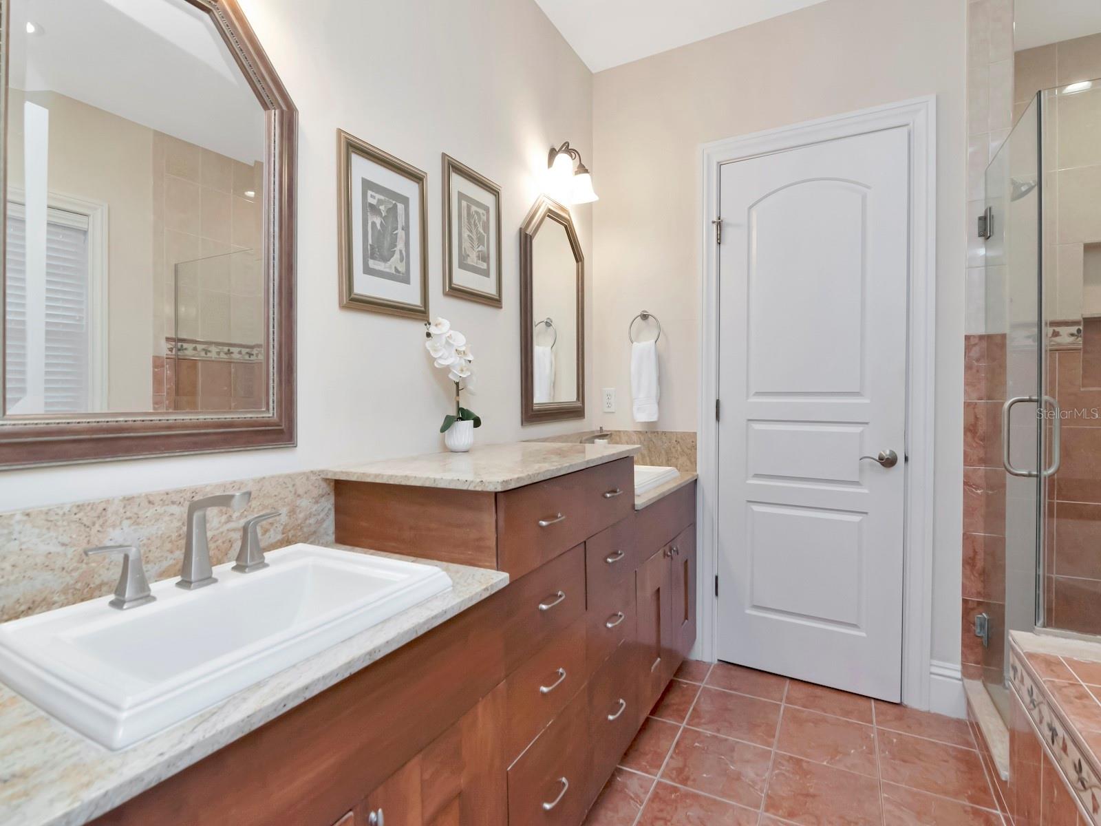 Primary Suite Bathroom with Dual Sinks, soaking tub, separate shower and water closet.
