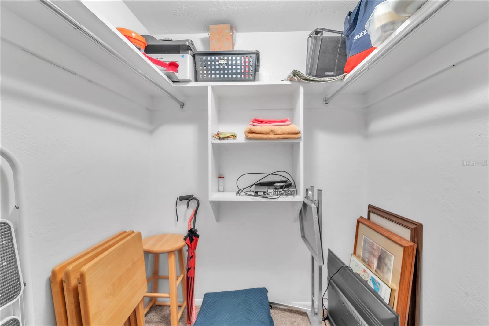 large walk-in closet in primary bedroom