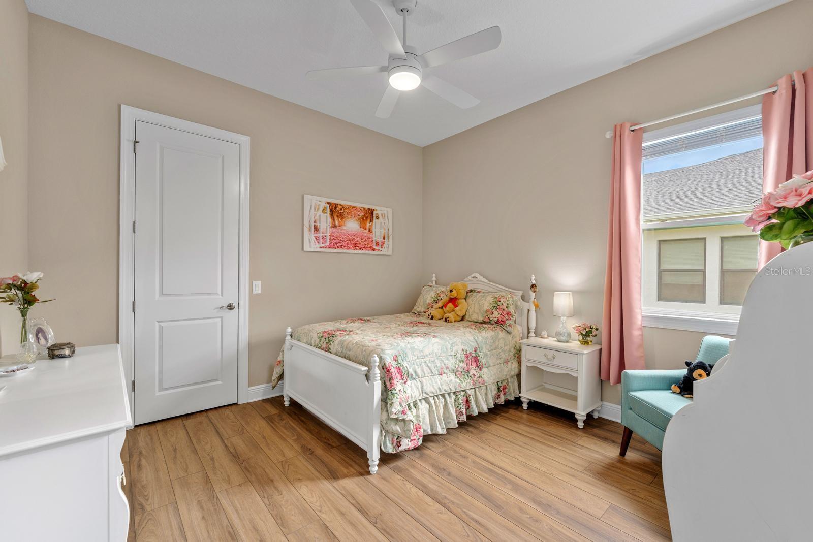Bedroom 3 has its own full bathroom in the hall and features high-end LVP flooring and a walk-in closet.