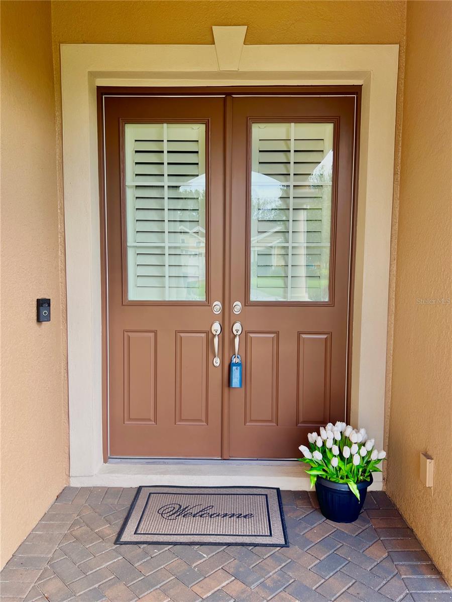 Plantation shutters on the double front doors.