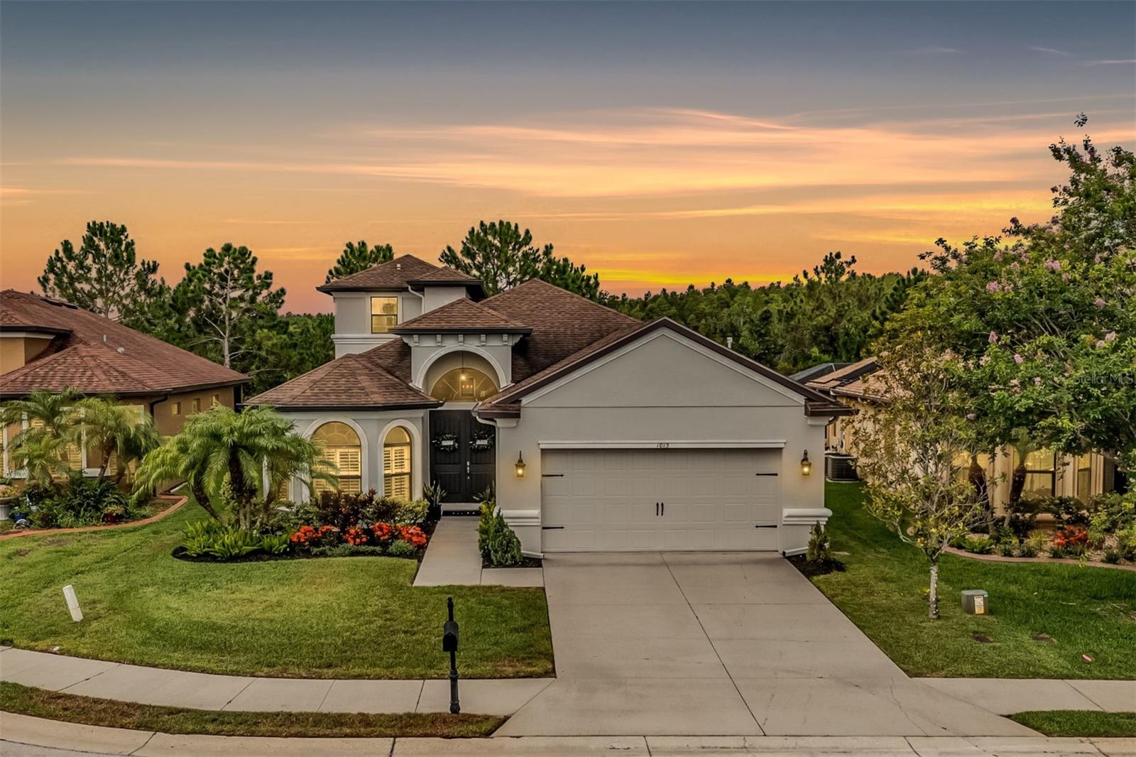 Wooded back drop with fantastic curb appeal