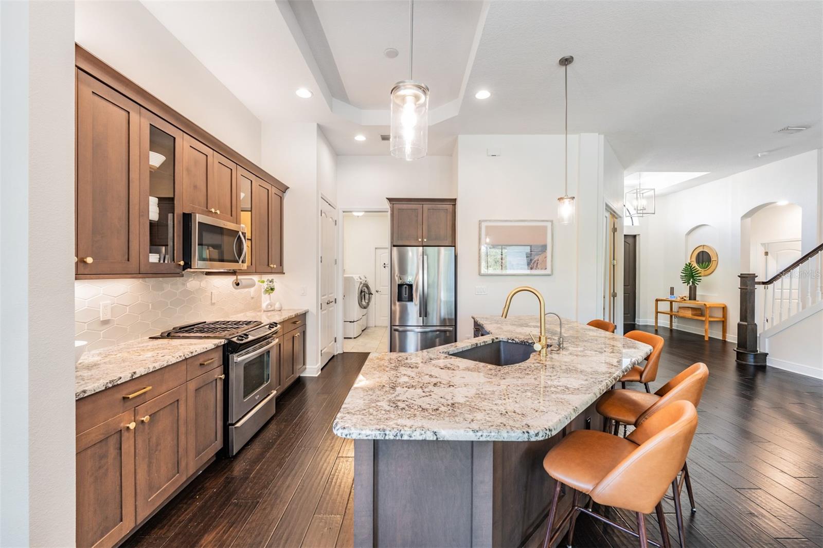 Award-winning kitchen design with custom wood cabinets and gas cooking