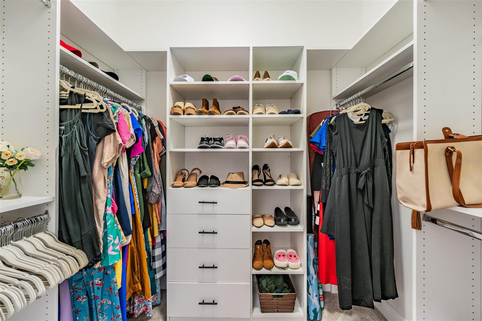 Custom walk-in closet with shelves and drawers