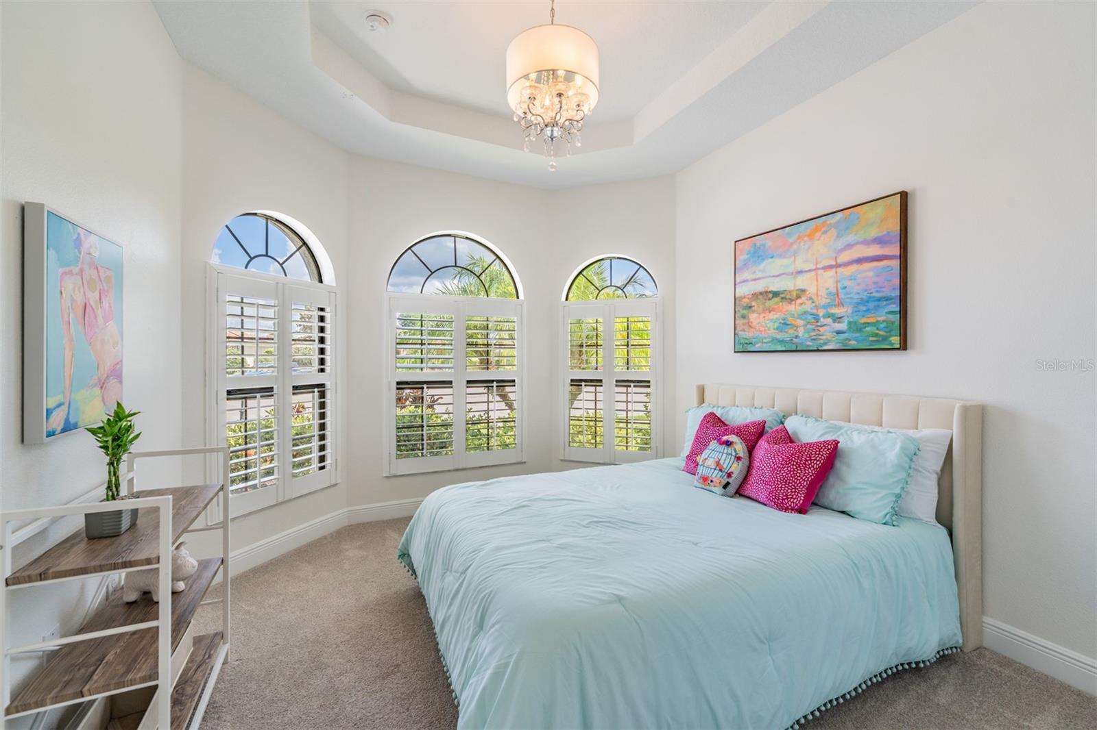 Bedroom 2 on main with arched windows and trey ceiling