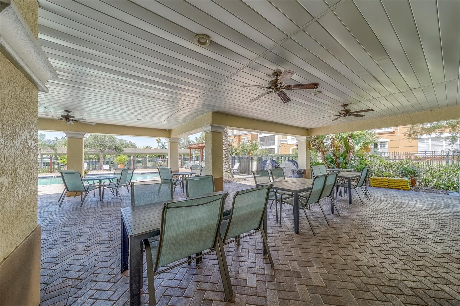 Covered seating area by the pool