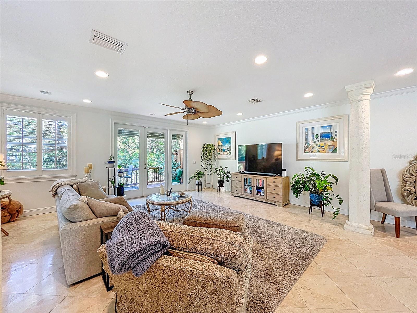 Family leads out to the large rear deck.