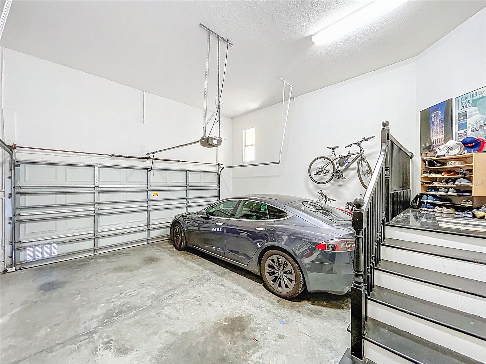 Garage has room for lots of upper storage, and is wired for electric vehicles.