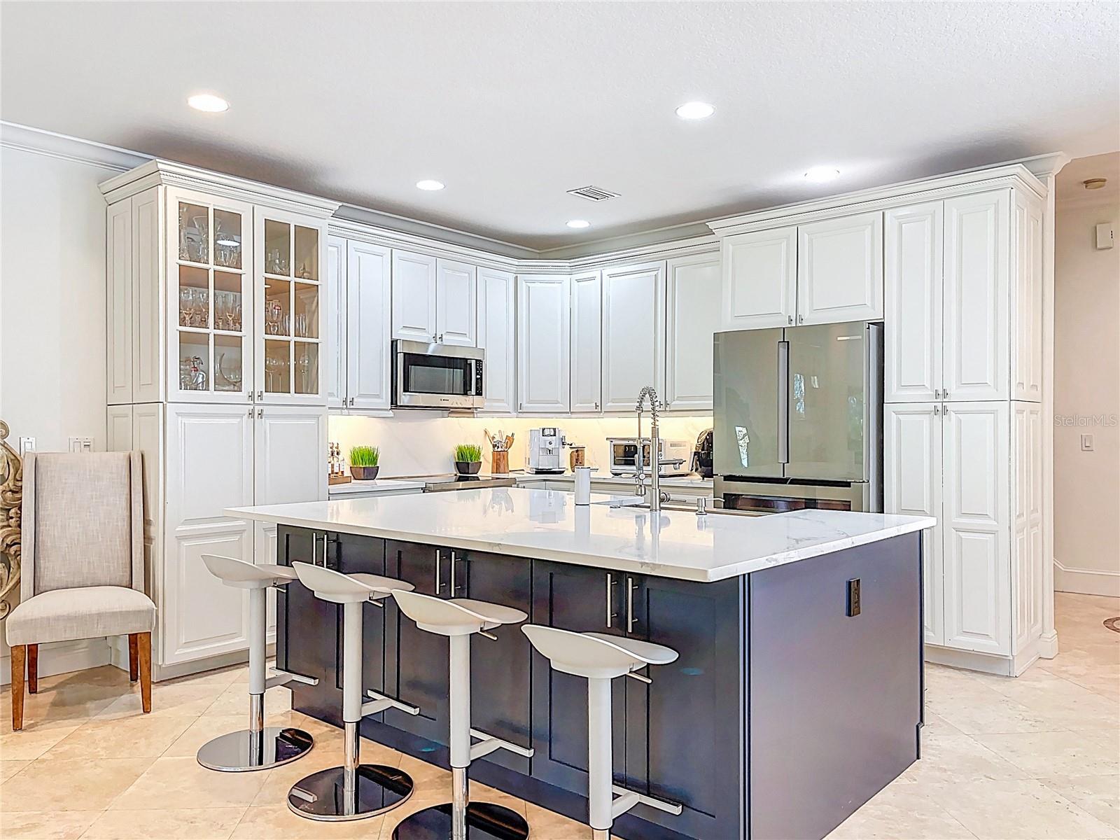 New kitchen with large, eat-in island.