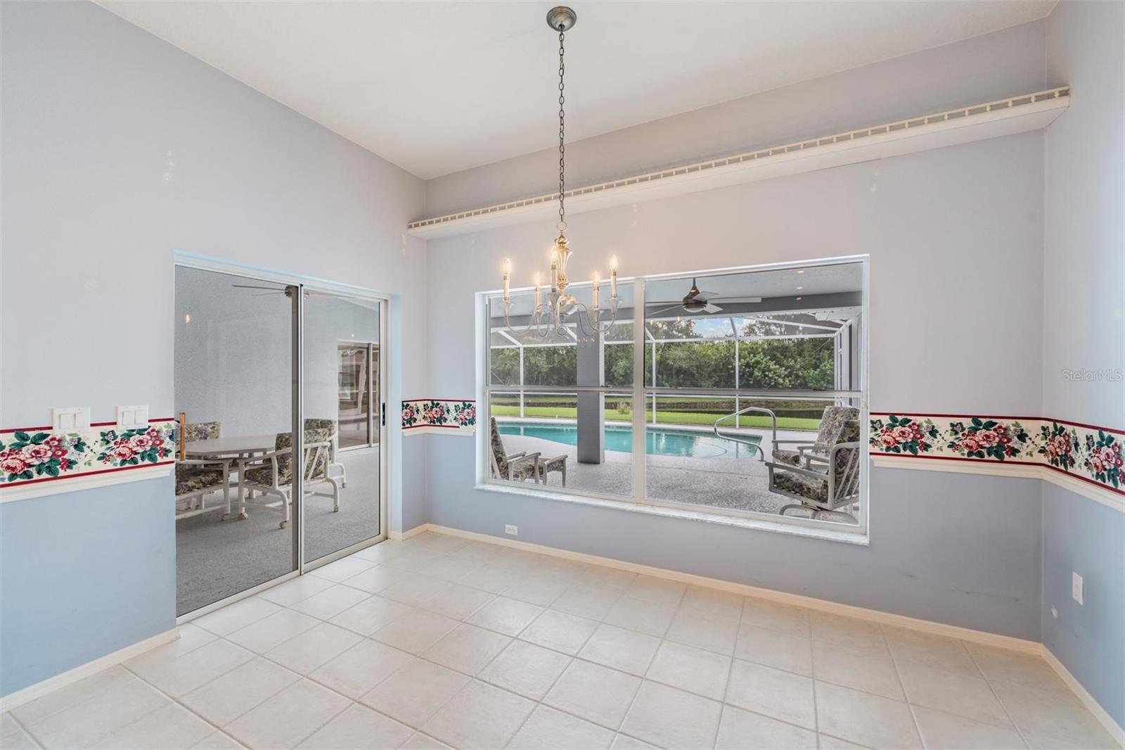 This breakfast nook has lanai, pool and pond views