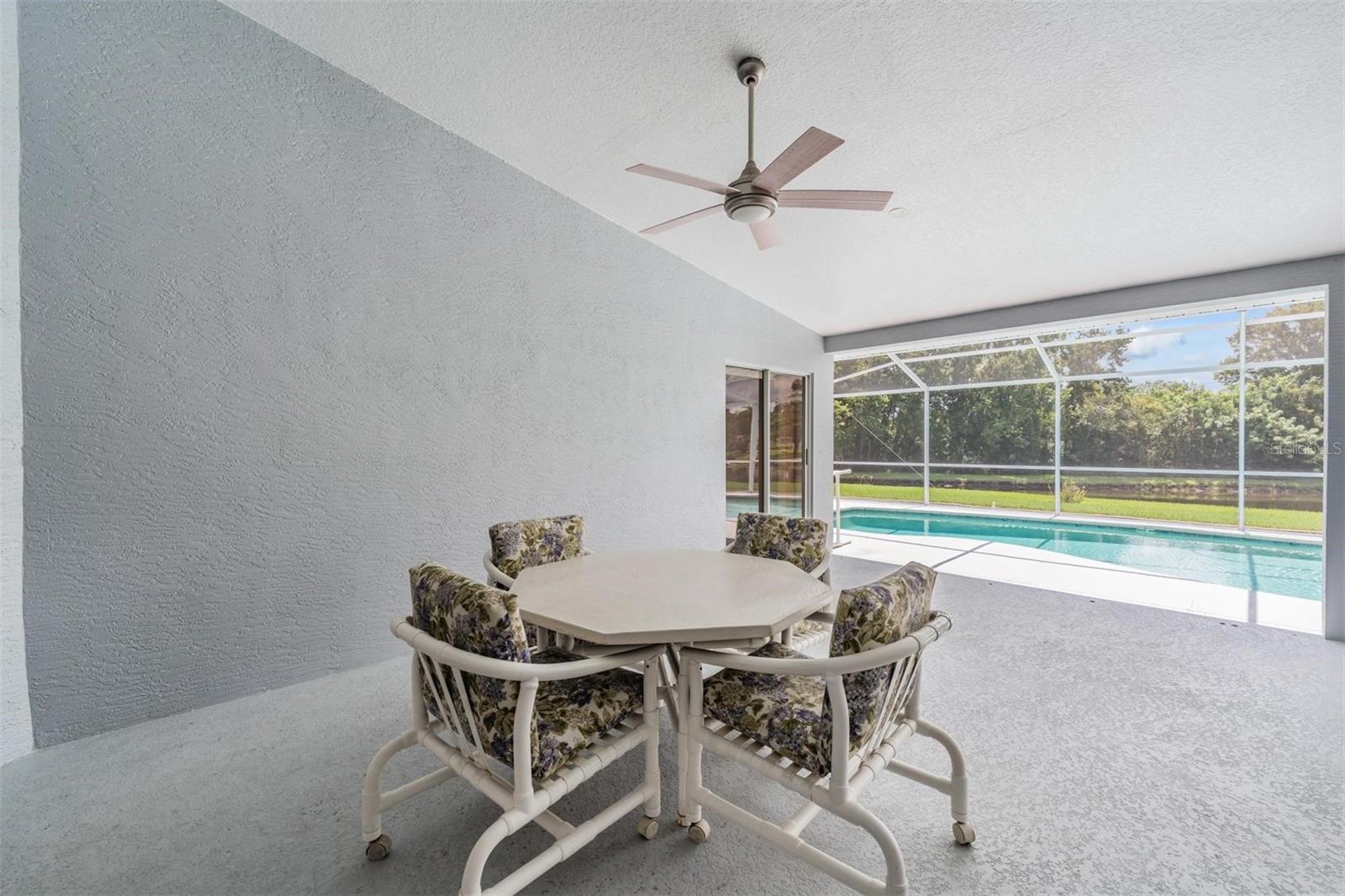 WOW! This oversized lanai is the perfect place to start or end your day with a view of the pond and pool