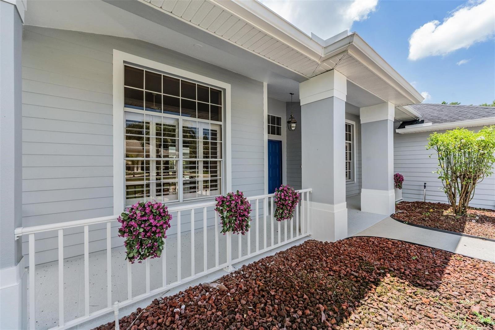 A charming front porch is awaiting your touch
