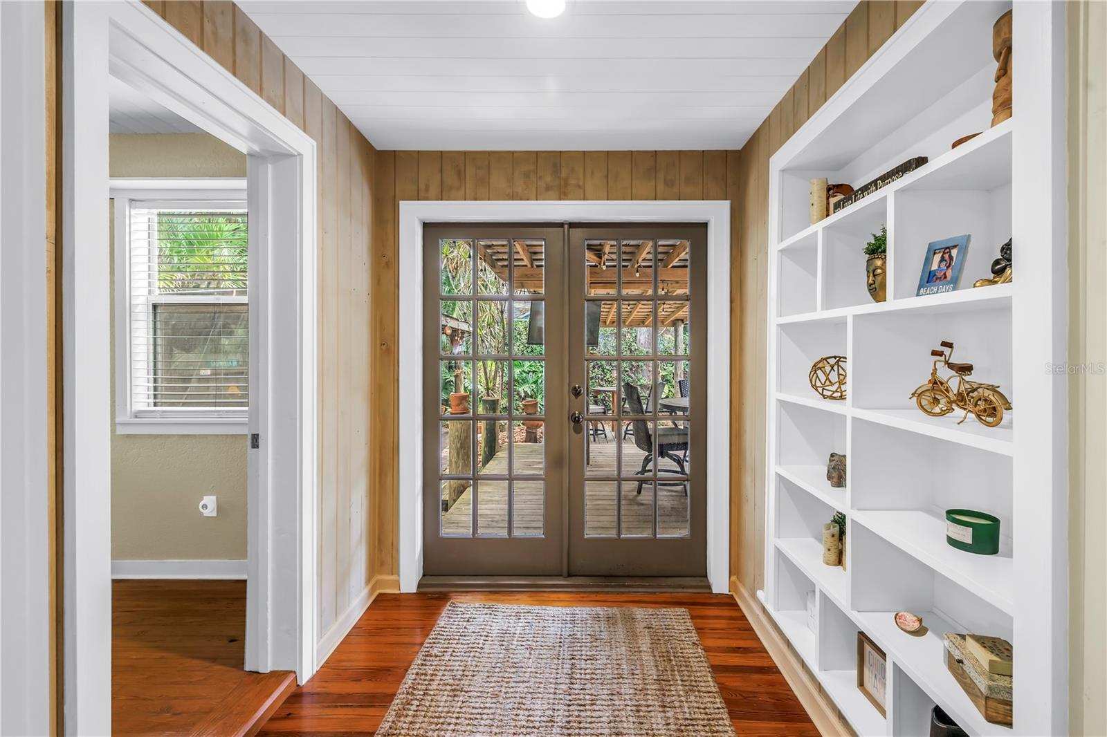 French doors to the backyard oasis