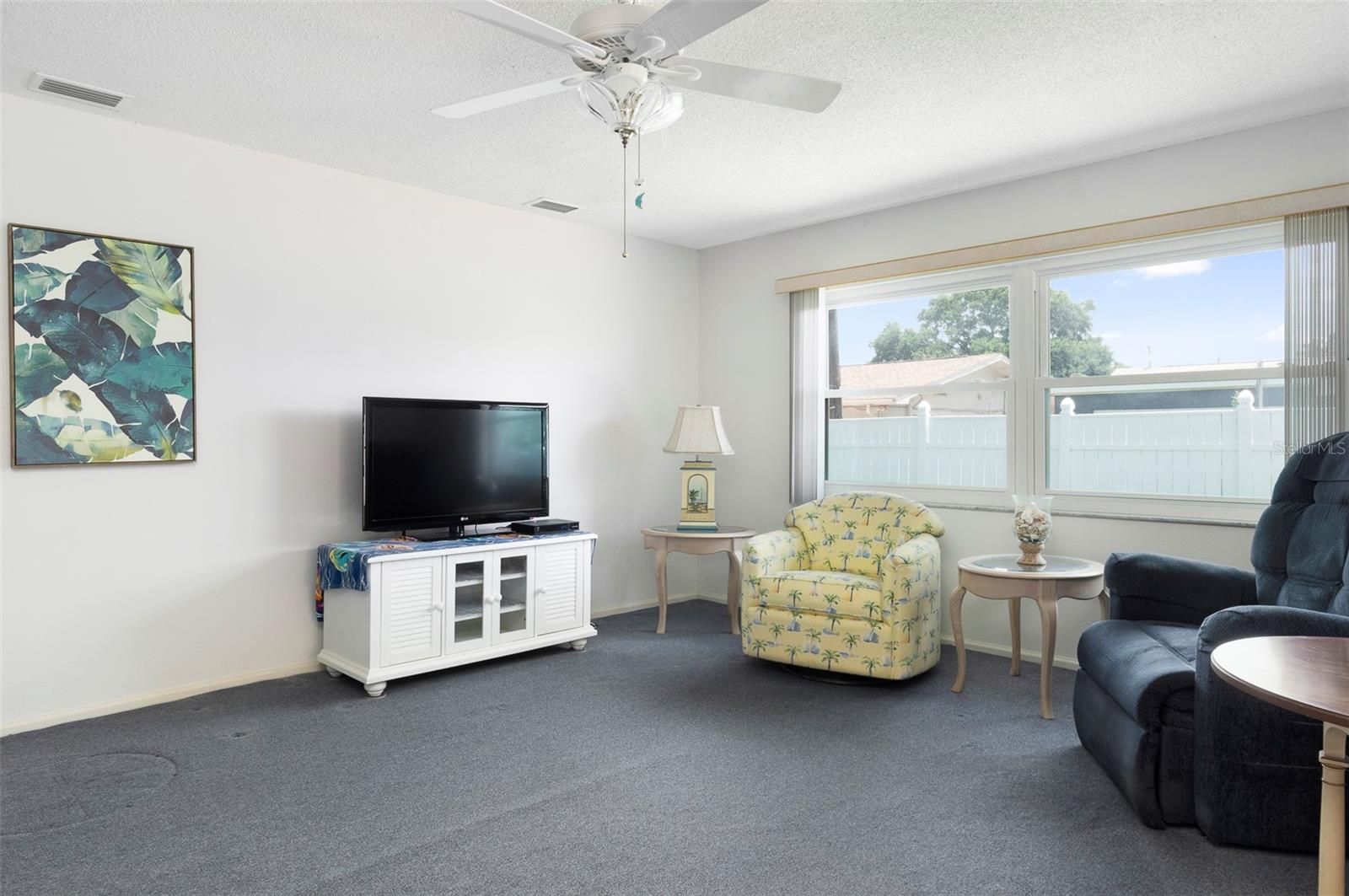 Spacious Family Room, with windows to the backyard