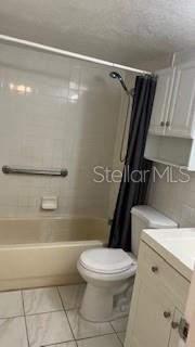 Your spacious bathroom ushers you into a modern flow of a stylish utility cabinet, flooring and safety shower bar