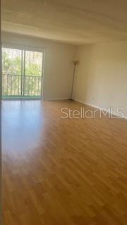 Large living room and dining room space for entertaining or relaxing while enjoying a treetop view
