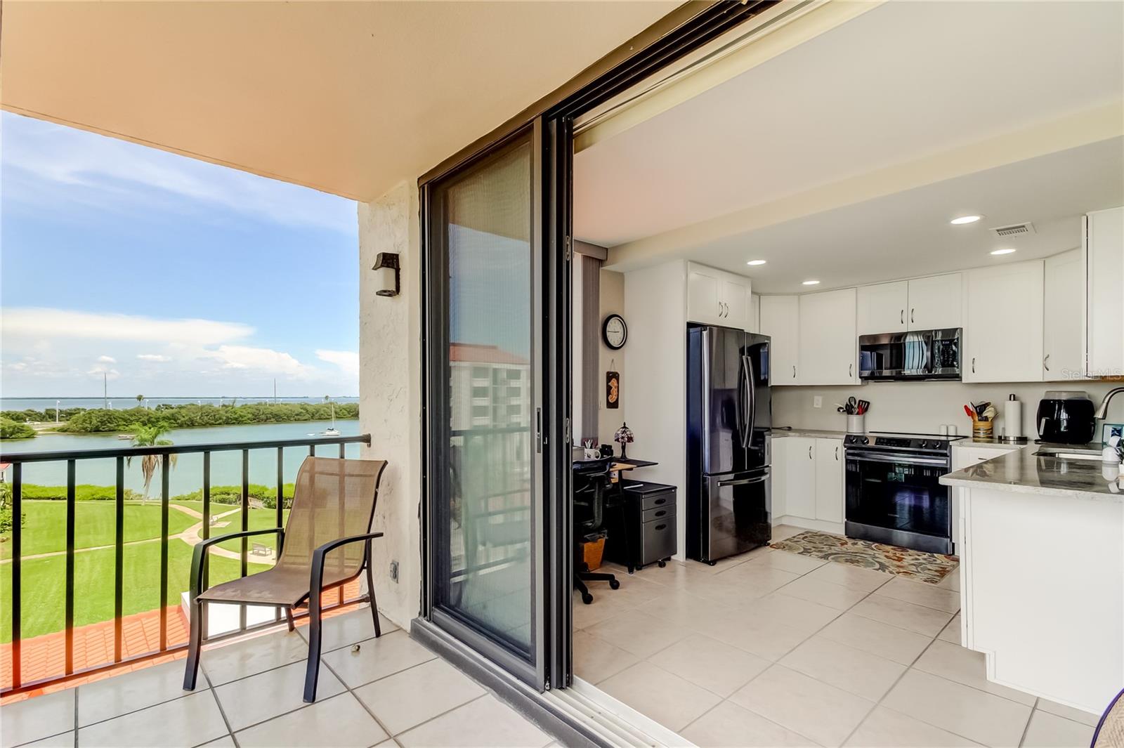 Sit on your Breezy Balcony and relax enjoying views of the Bay and golf course.