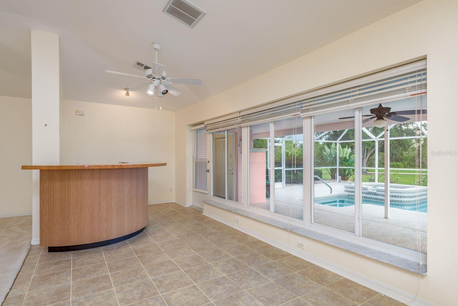 Dry Bar and Access to Enclosed Screened Patio