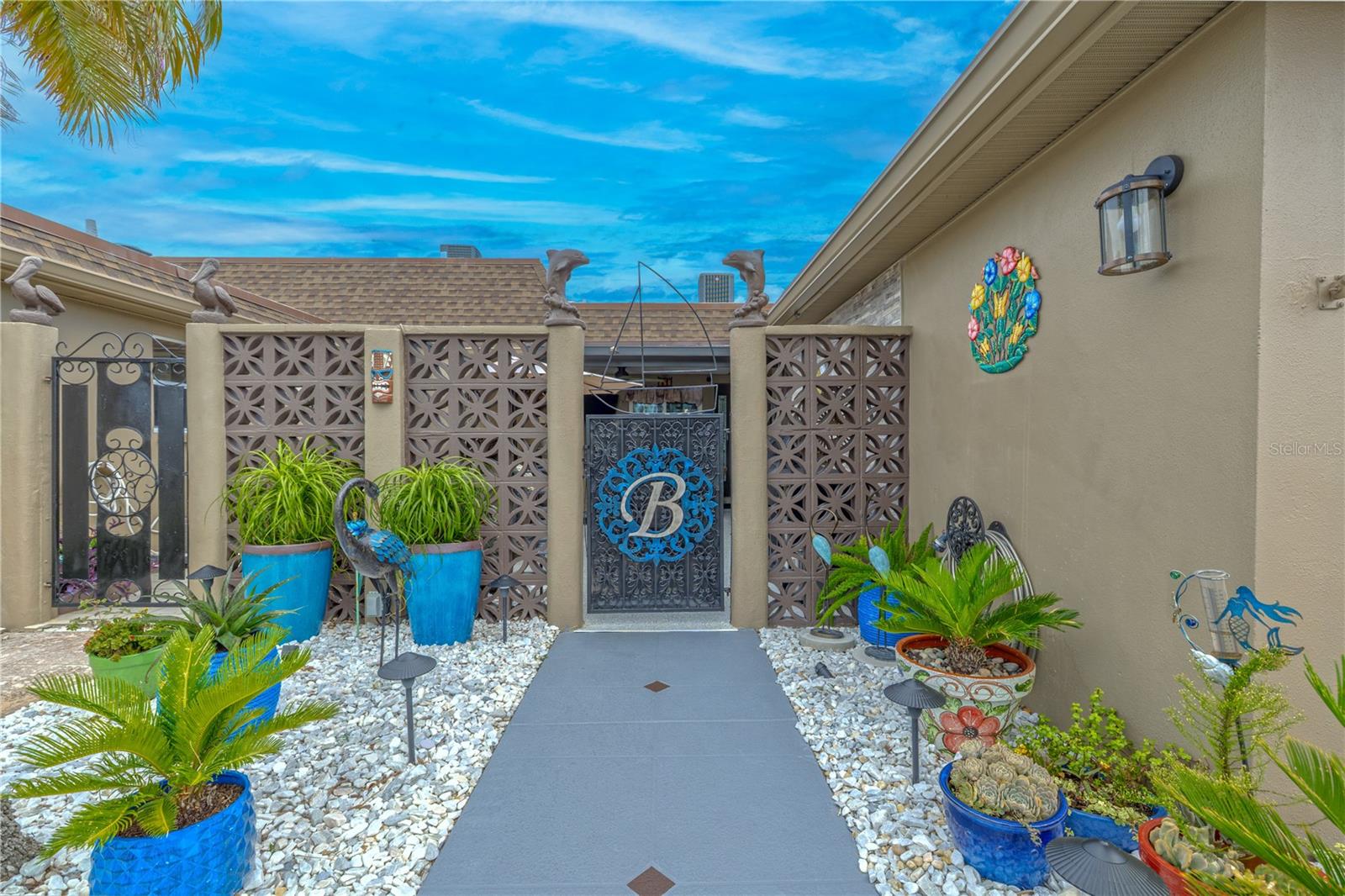 Meticulous, 2 Bedroom, 2 Bath with one and a half car garage, water view! The front entry features 2 customized landscape beds with 12 volt LED lighting (19 total lights) and decorated with heat resistant, low water maintenance plants.  Beds are covered w/white stone over weed control sheeting for low maintenance.