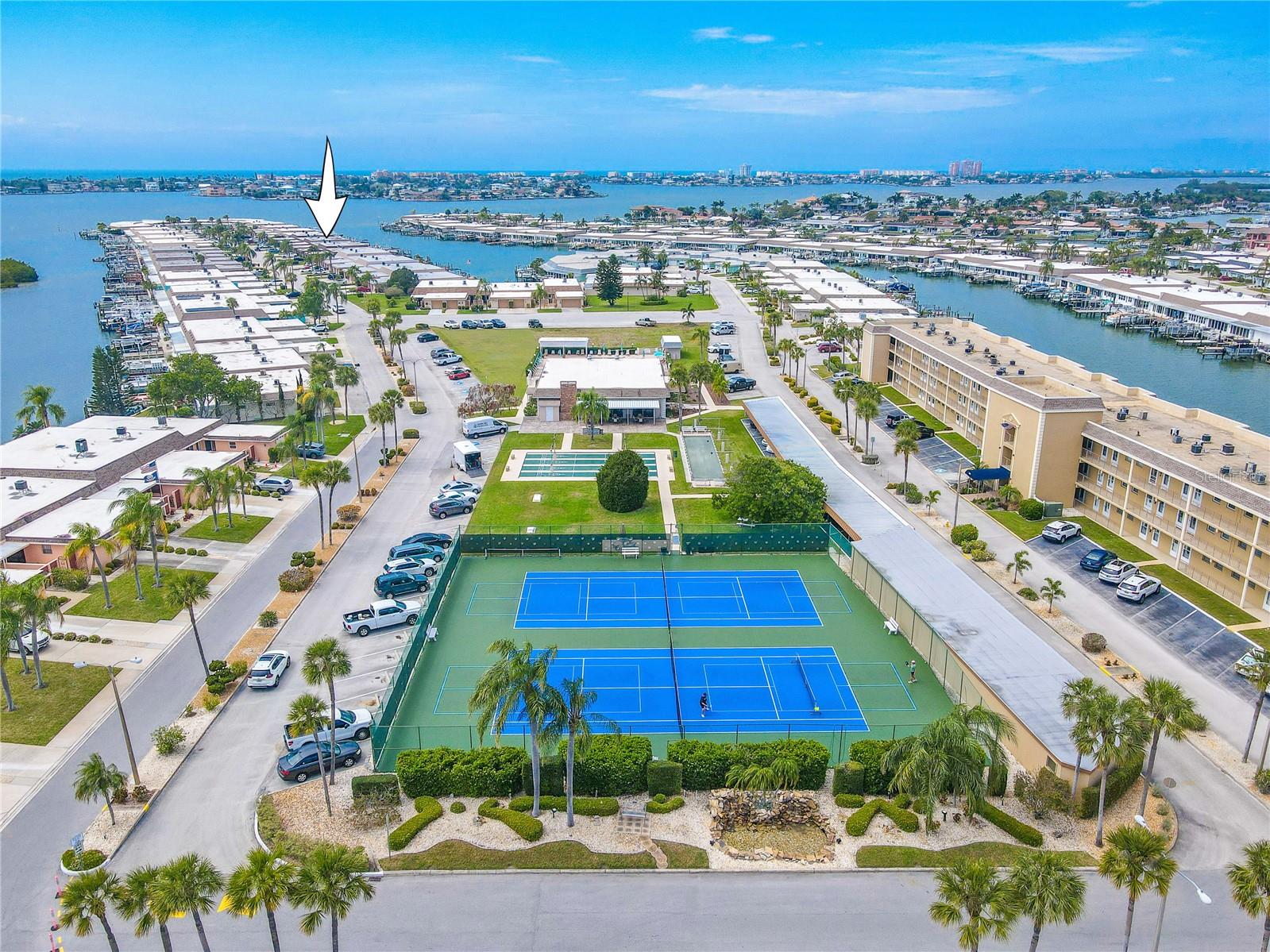 Boca Ciega Point offers 24/7 gated access (no guard), flood insurance, water, sewer, trash, Spectrum fiberoptic cable with 300+ channels & high-speed WiFi, roof and exterior maintenance, lawn service, pool, pickleball, tennis, sauna, putting green, two clubhouses with kitchens, and vibrant social amenities.