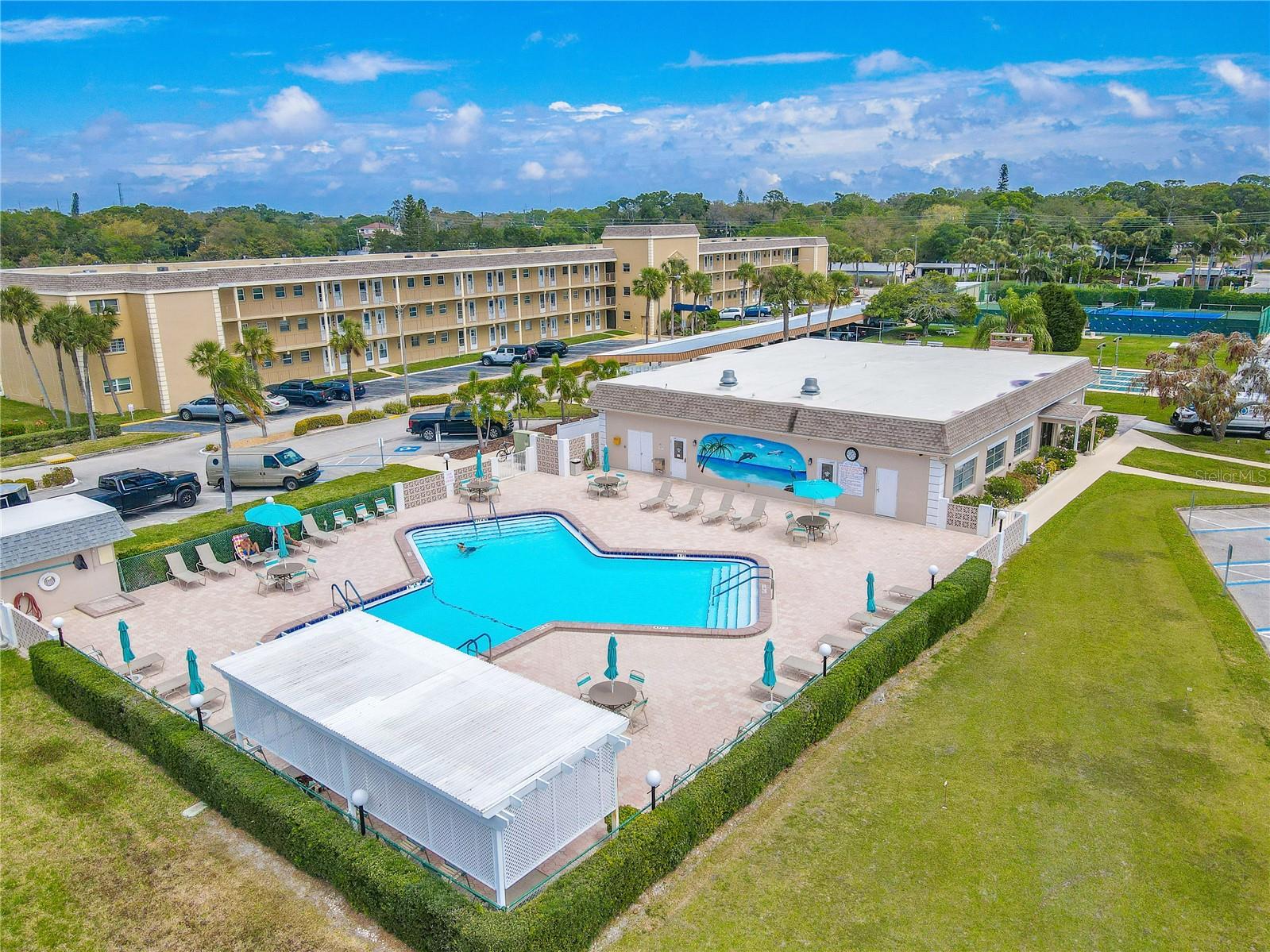 Boca Ciega Point offers 24/7 gated access (no guard), flood insurance, water, sewer, trash, Spectrum fiberoptic cable with 300+ channels & high-speed WiFi, roof and exterior maintenance, lawn service, pool, pickleball, tennis, sauna, putting green, two clubhouses with kitchens, and vibrant social amenities.
