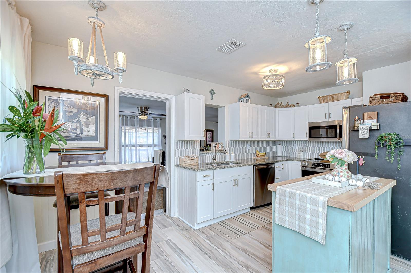 Beautiful cabinets, island, and backsplash!