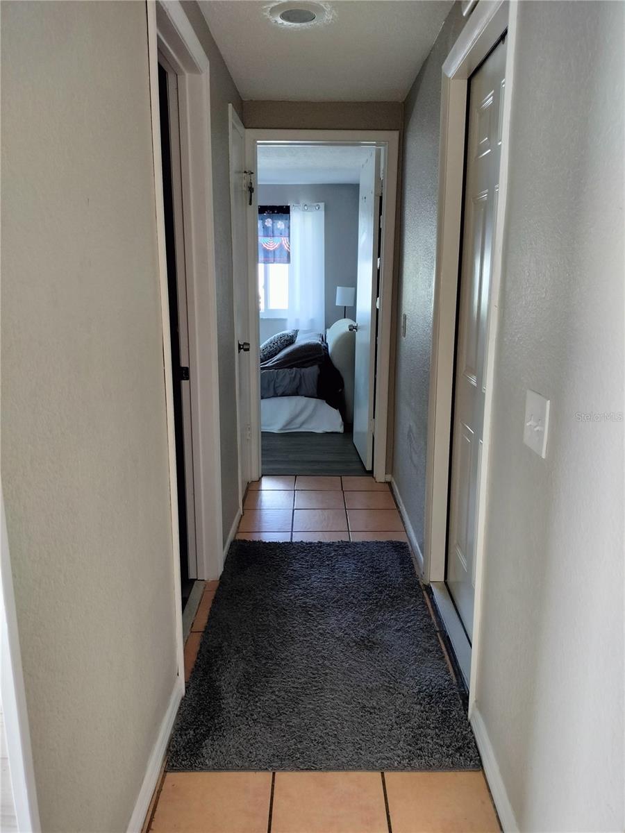 Hallway to guest bath, guest bedroom and garage.