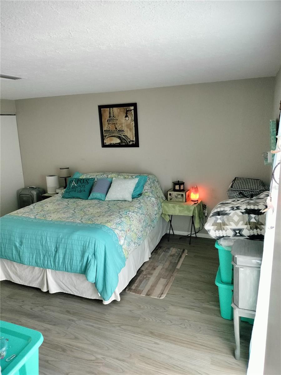 Primary bedroom with wall length closet