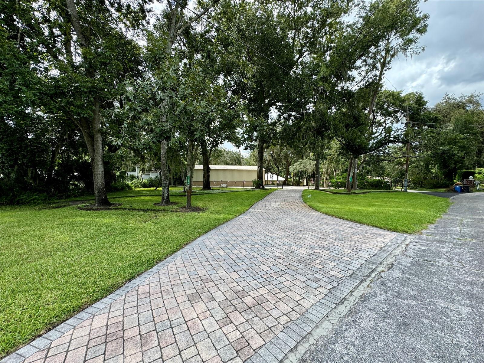 Entry from Street to Fenced Riverfront Estate