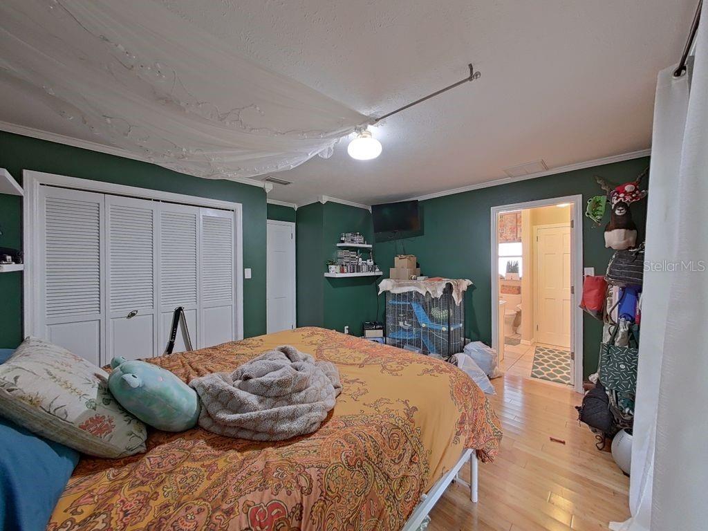2nd Bedroom with En Suite Bathroom and Doors to Back Porch