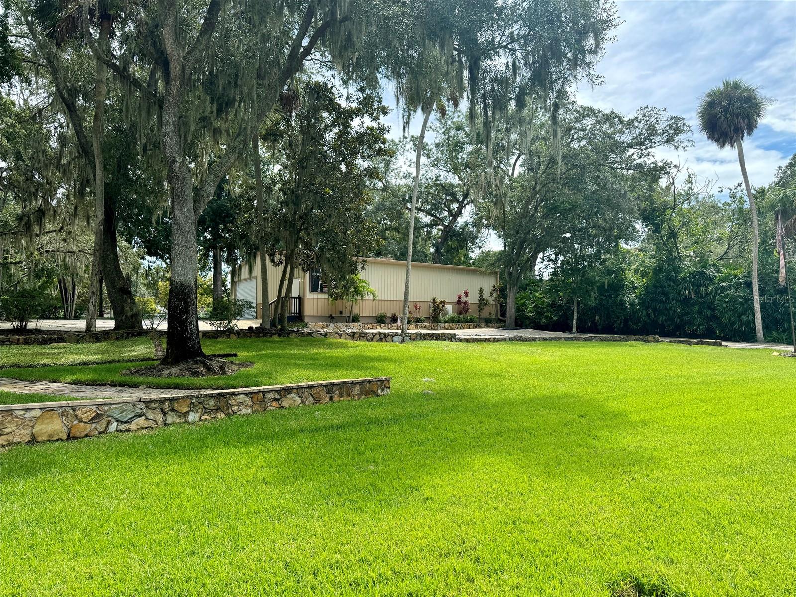 Large Front Yard with Space between Main Home and Workshop/Garage