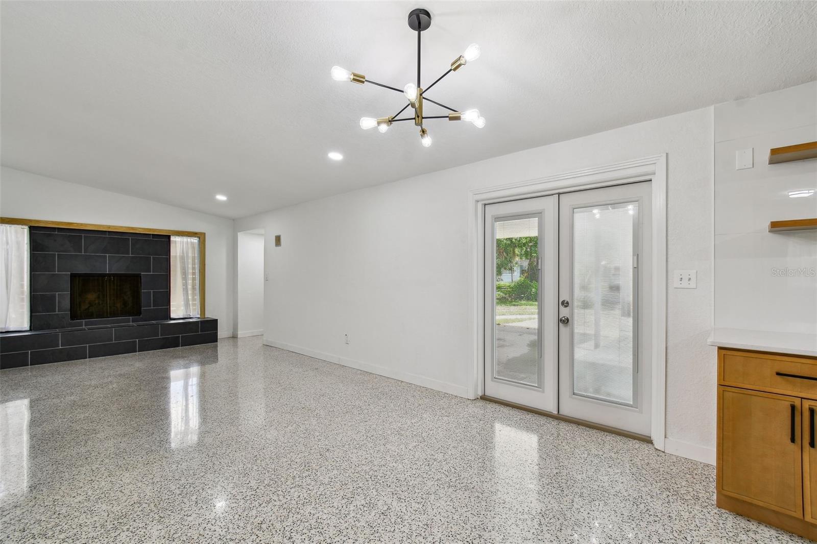 Terrazzo Floors with French Doors to Patio & Deck