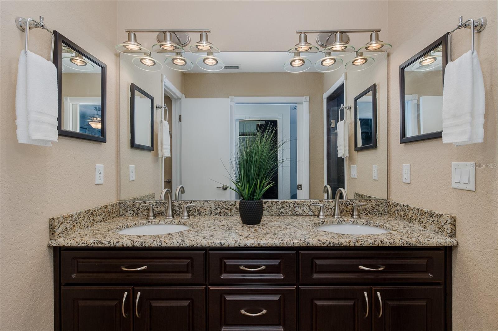 Dual vanity and separate water closet.
