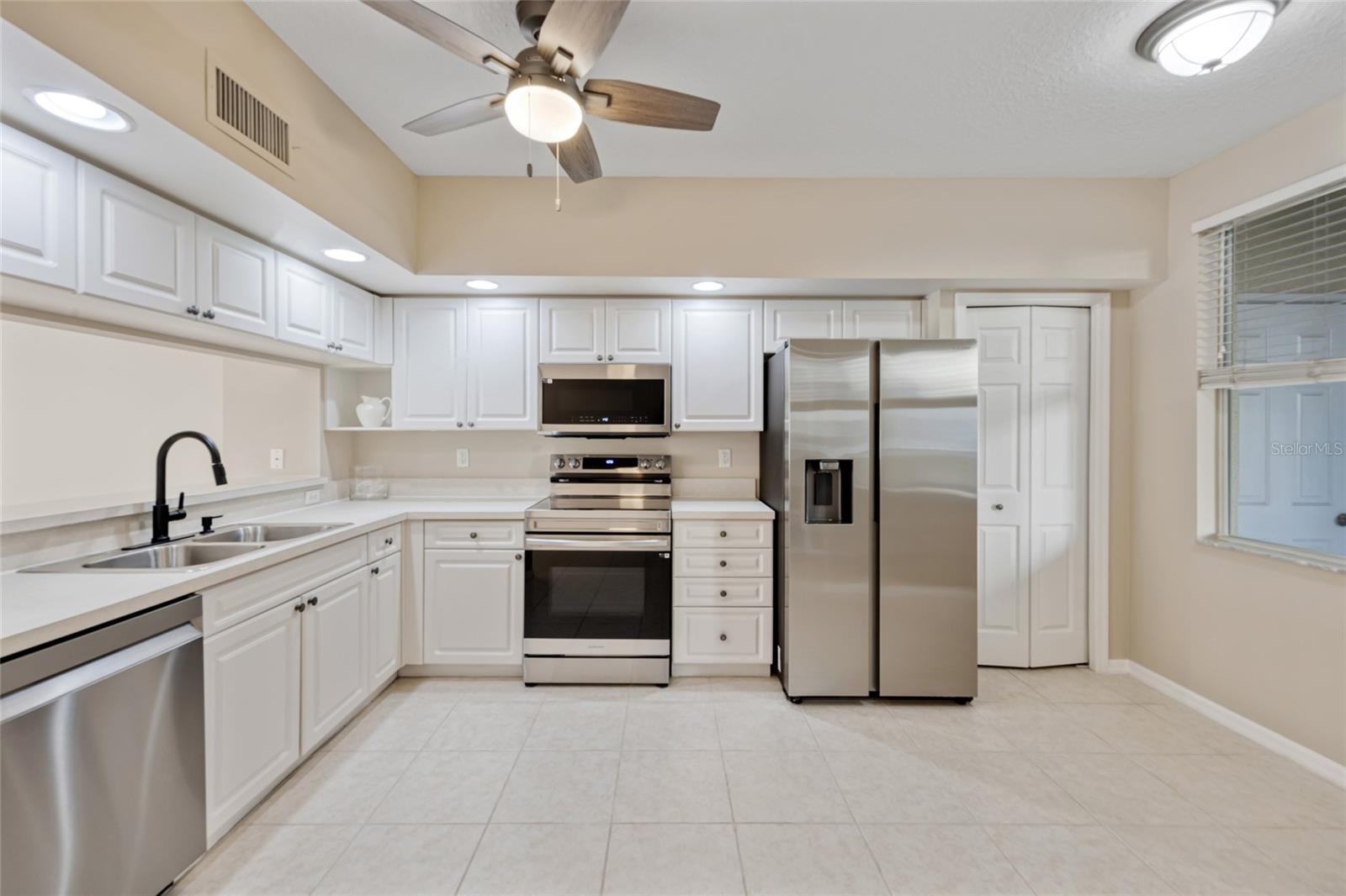 Brand New Samsung appliances with space for a breakfast nook.