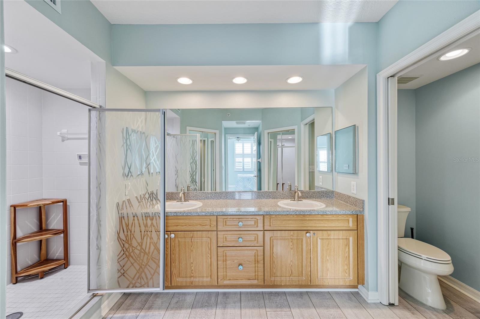 Relax in this tranquil retreat of a Primary En Suite with dual sinks, private water closet, large walk in shower.