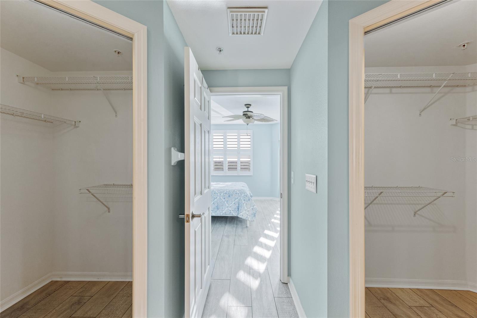 His & Hers spacious walk in closets in primary En Suite.