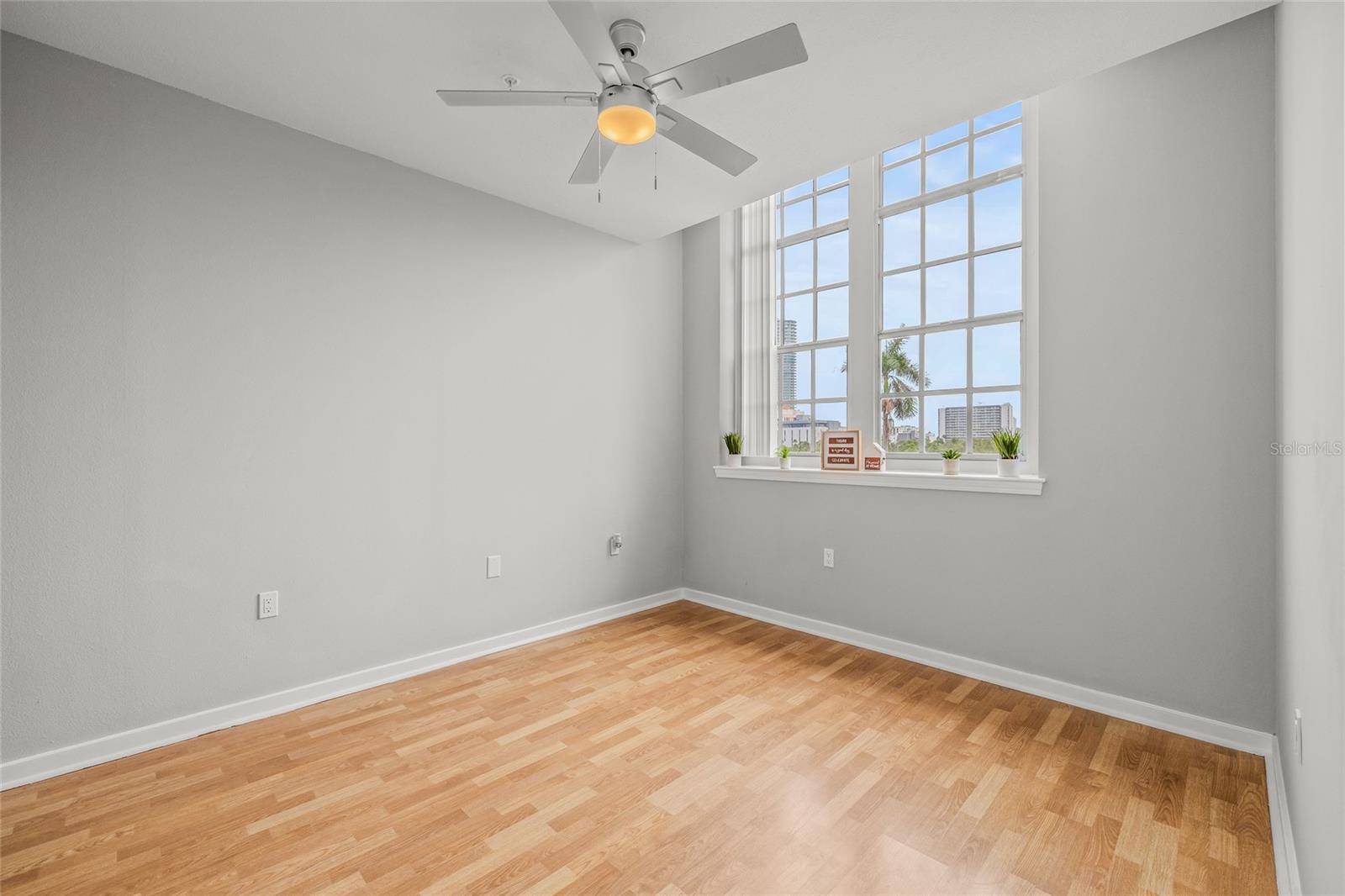 There is a Spacious Master Bedroom with a gorgeous new fan/light