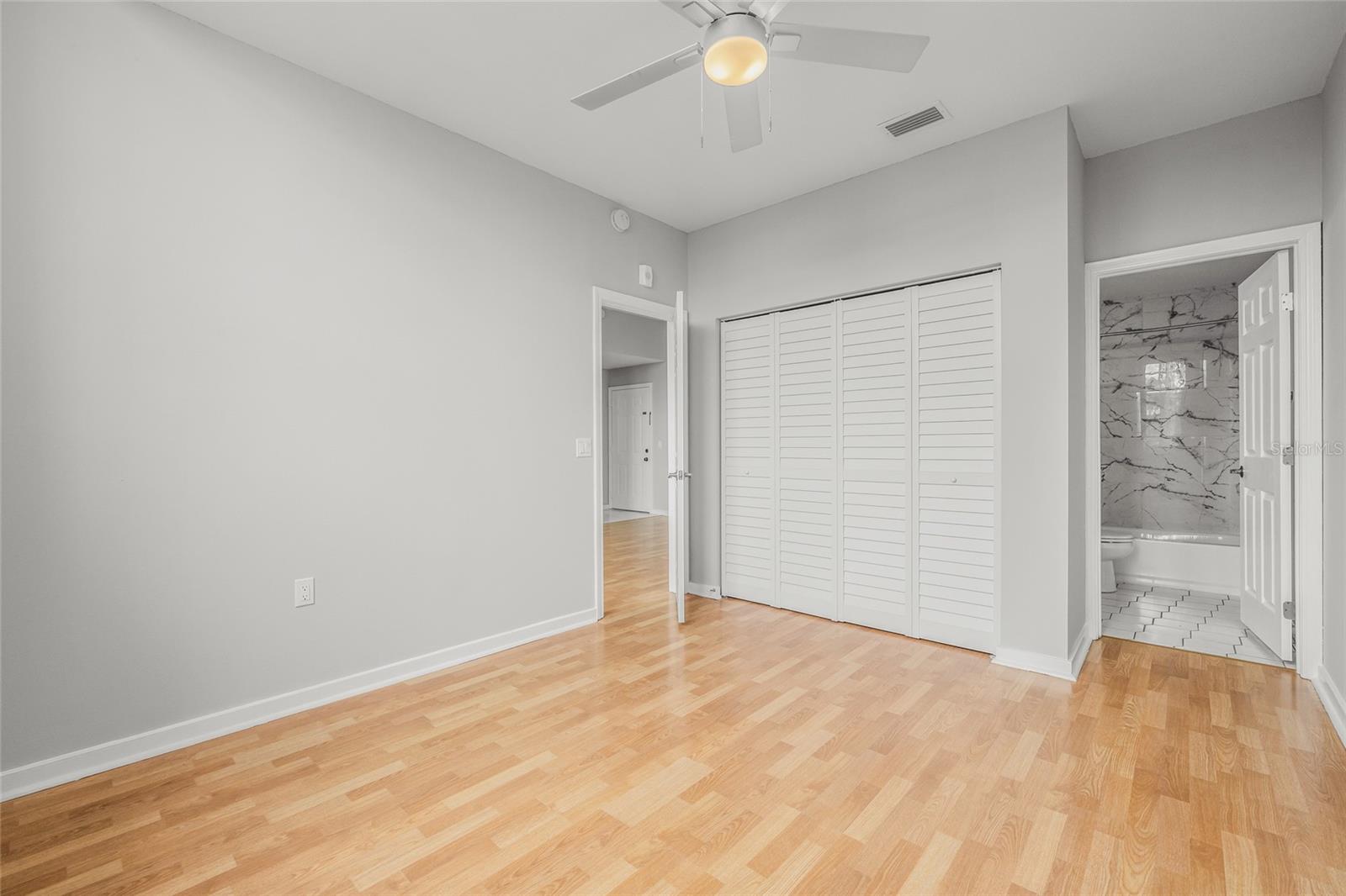 The Master Bedroom has beautiful laminate floors and new closet doors