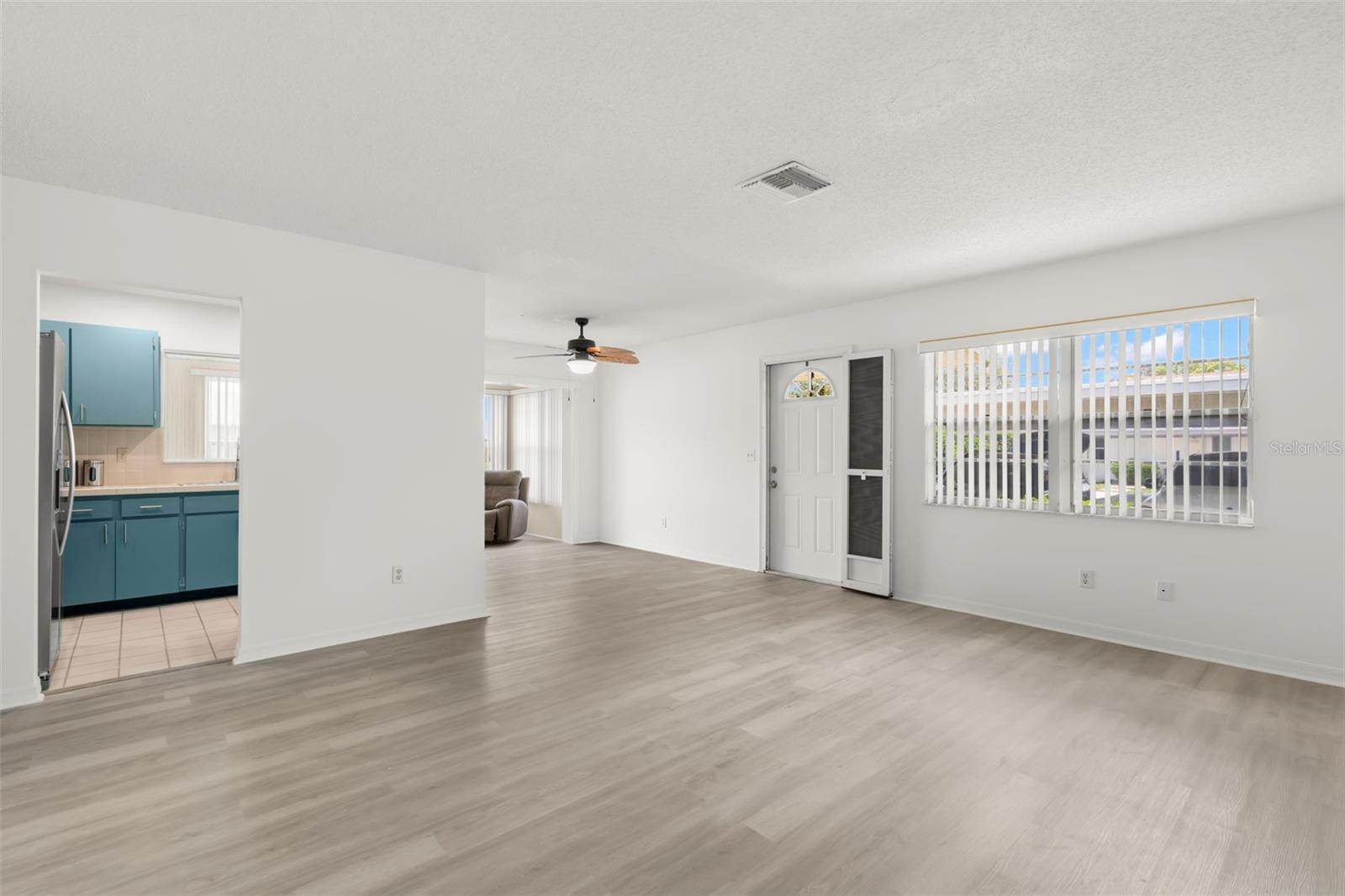 Living, Dining and a view of the Kitchen