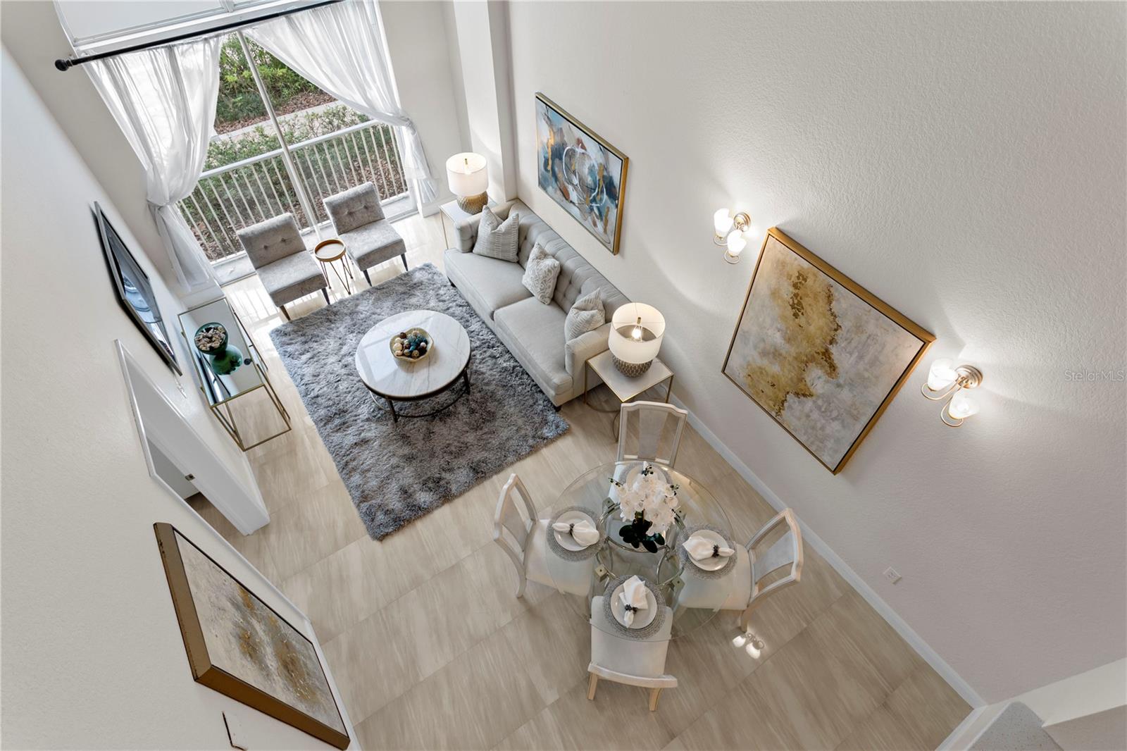 Exclusive to first-floor units, vaulted ceilings elevate the open-concept living space, enhancing the sense of volume and openness