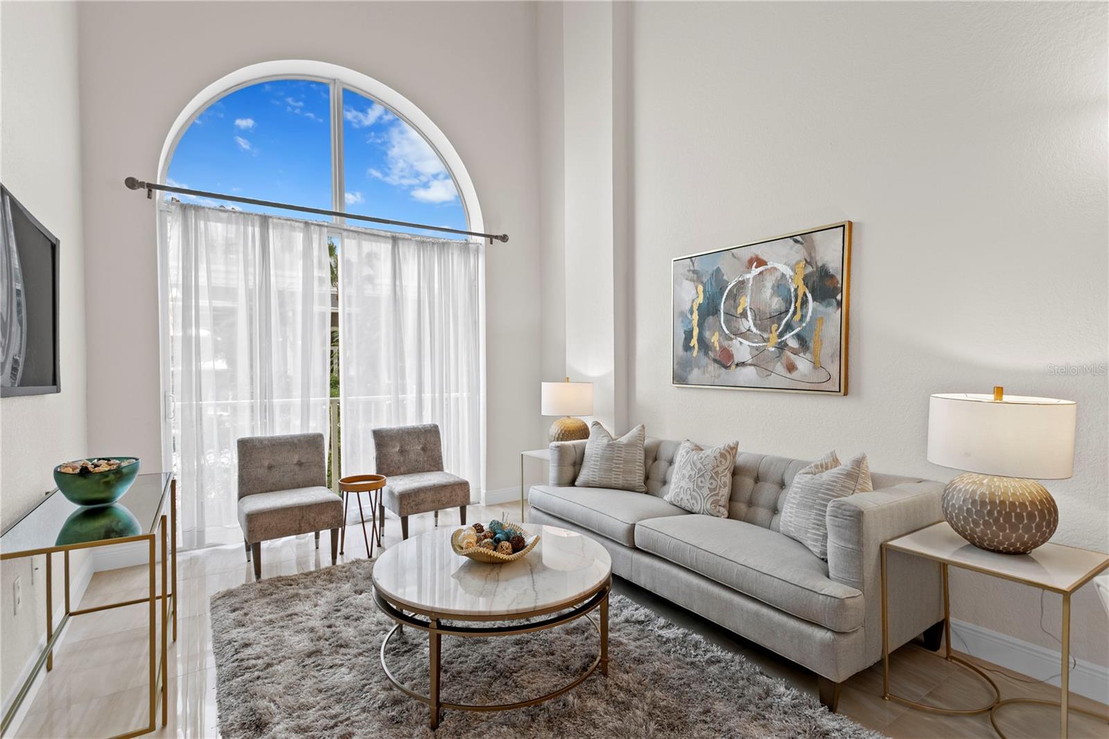 Step inside to soaring ceilings and an abundance of natural light that fills the spacious living and dining area.