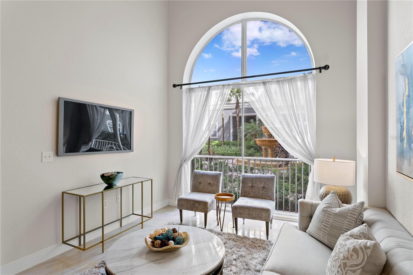 Exclusive to first-floor units, vaulted ceilings elevate the open-concept living space, enhancing the sense of volume and openness